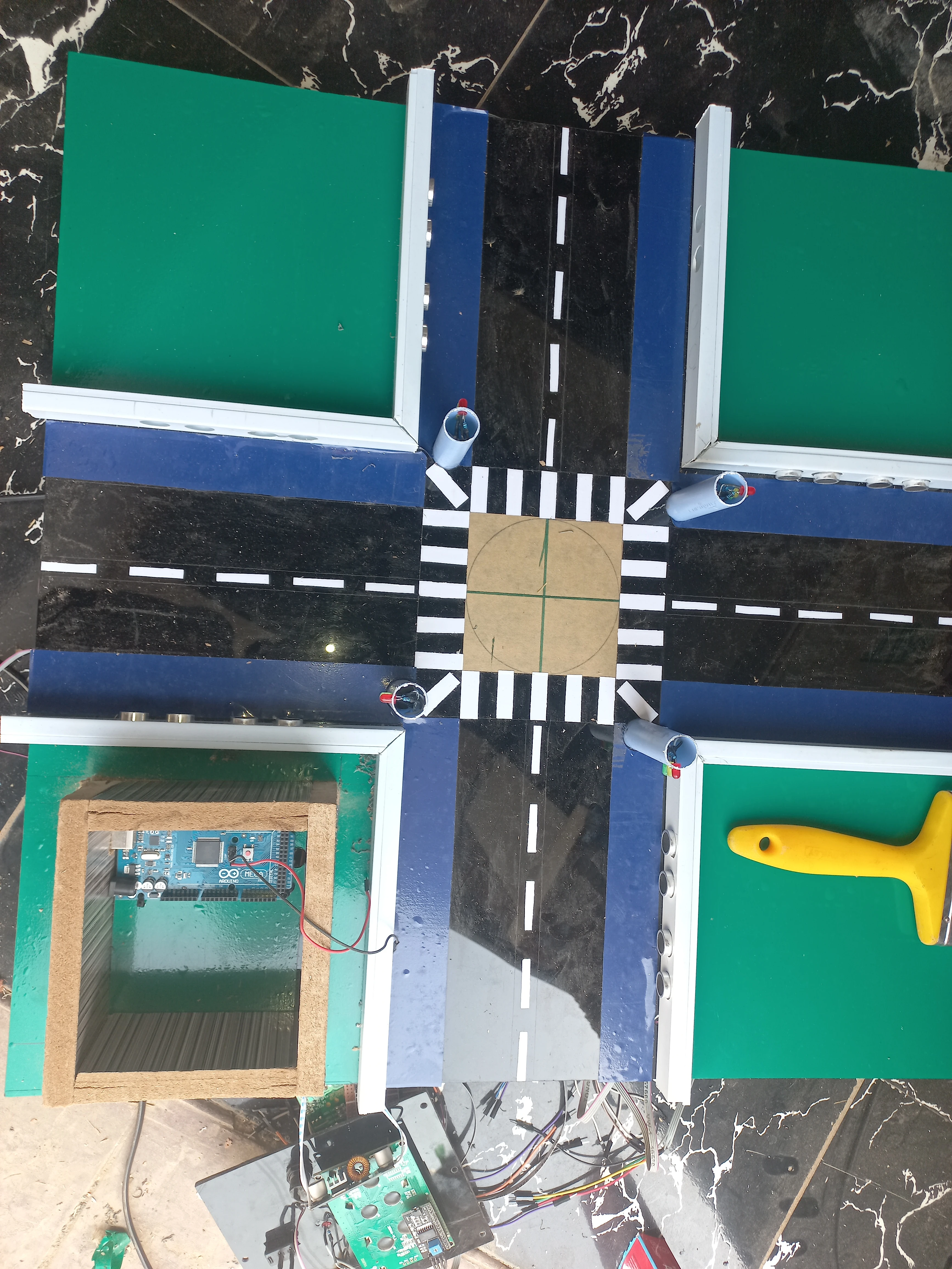 Road model alongside the Arduino Mega control box before wiring