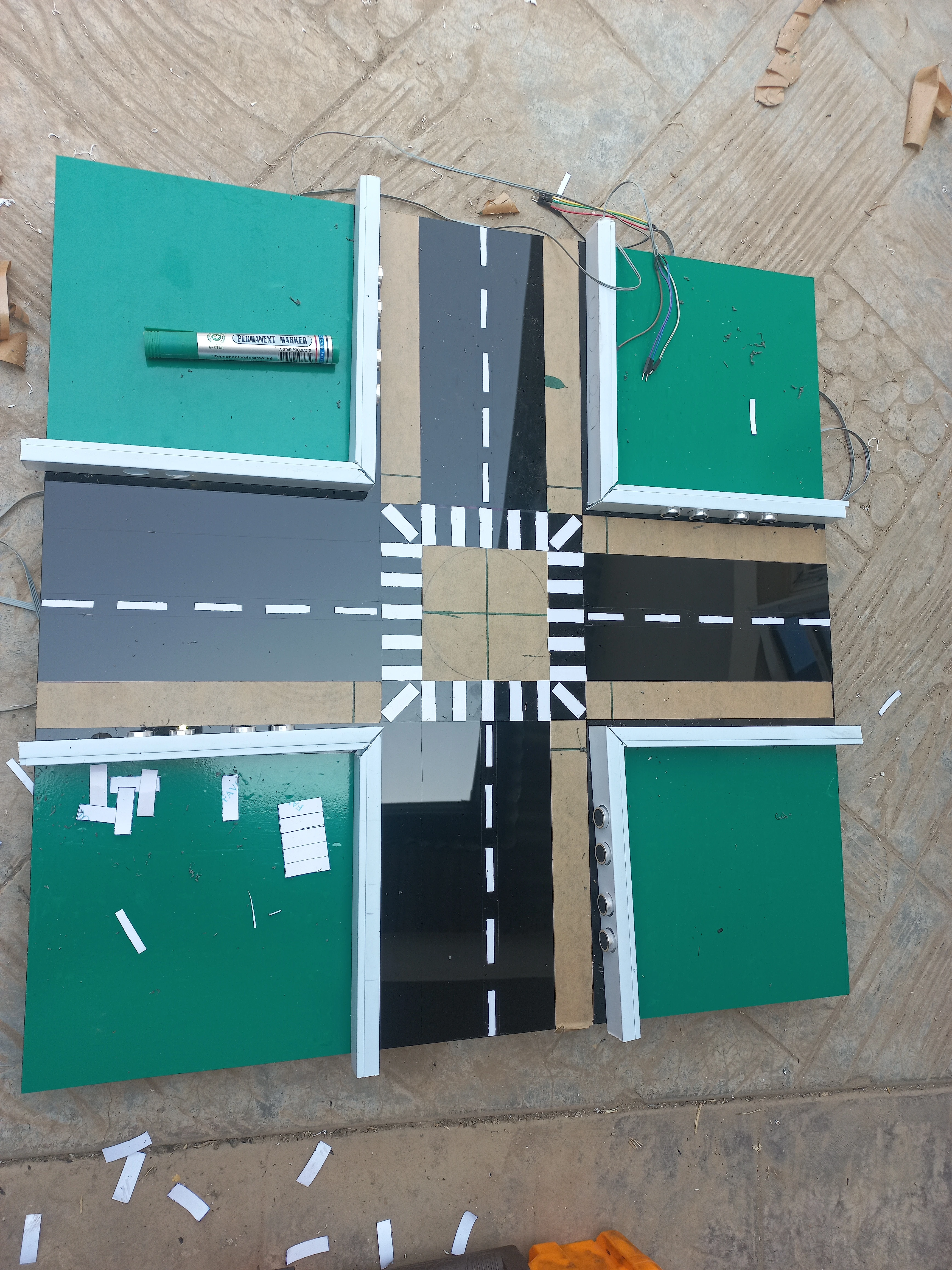 Completed road surface with crosswalk markings and LED holes drilled