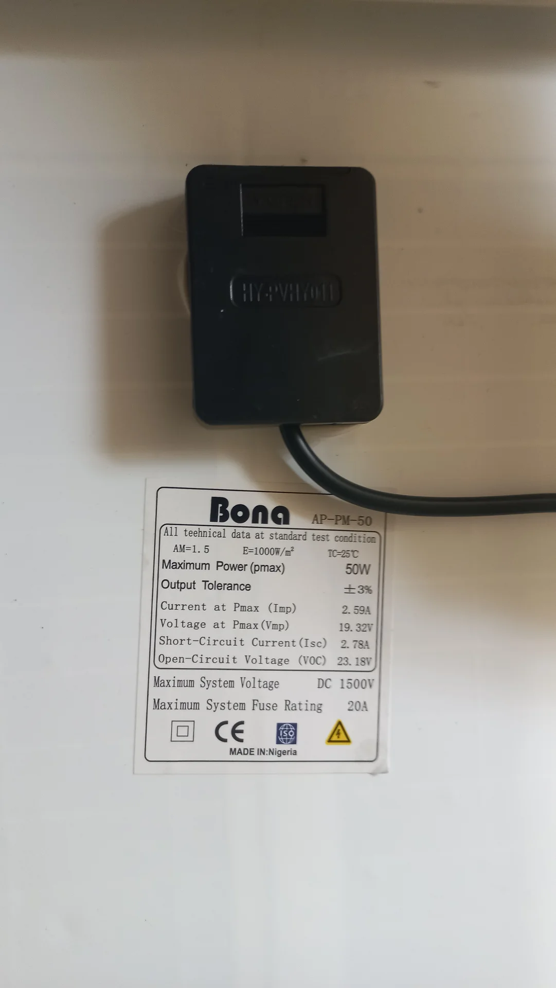 Close-up of the Bona AP-PM-50 solar panel spec label: 50 W maximum power, Vmp 19.32 V, Voc 23.18 V, Isc 2.78 A, with junction box connector above
