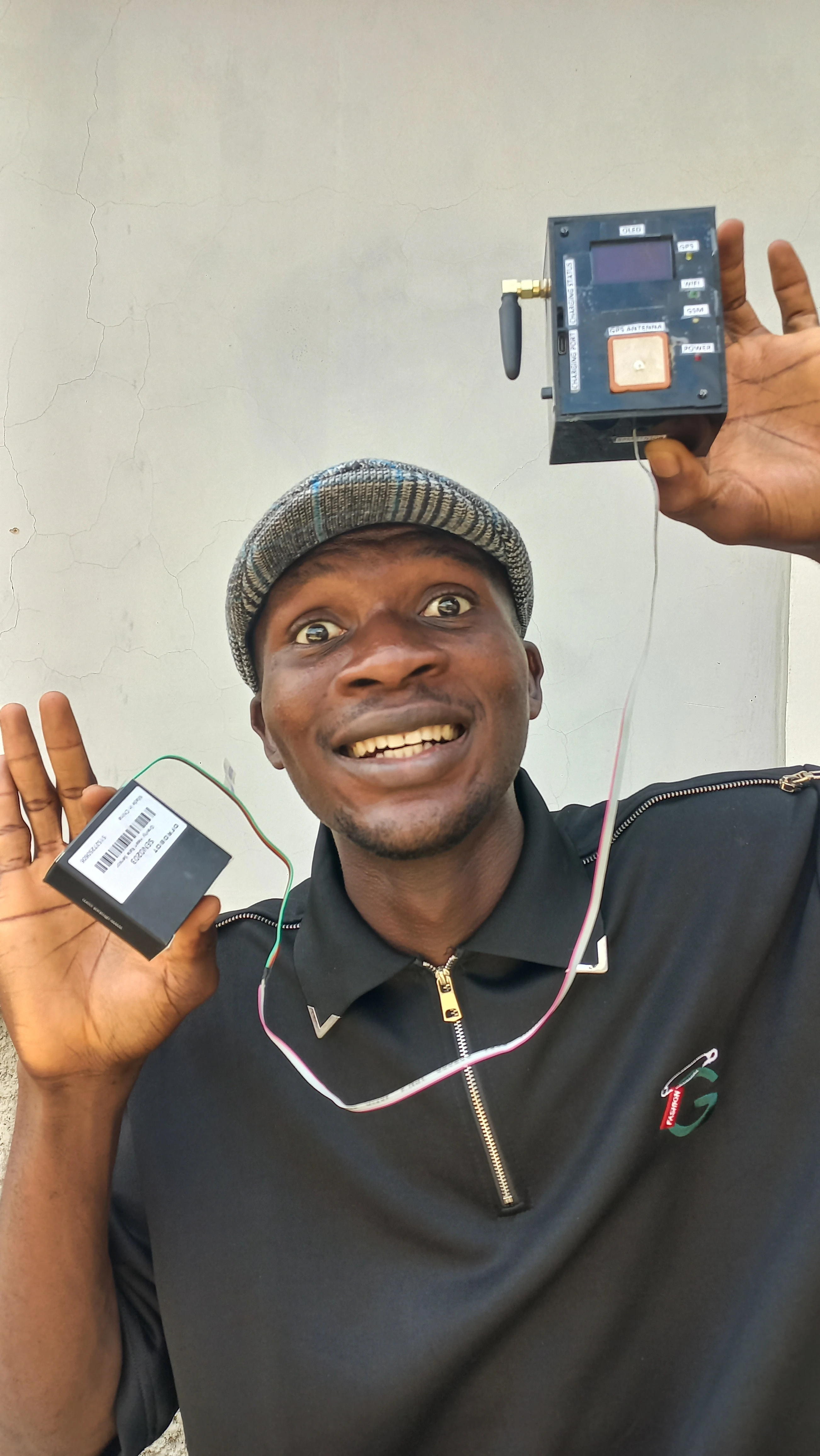 Developer smiling broadly with device