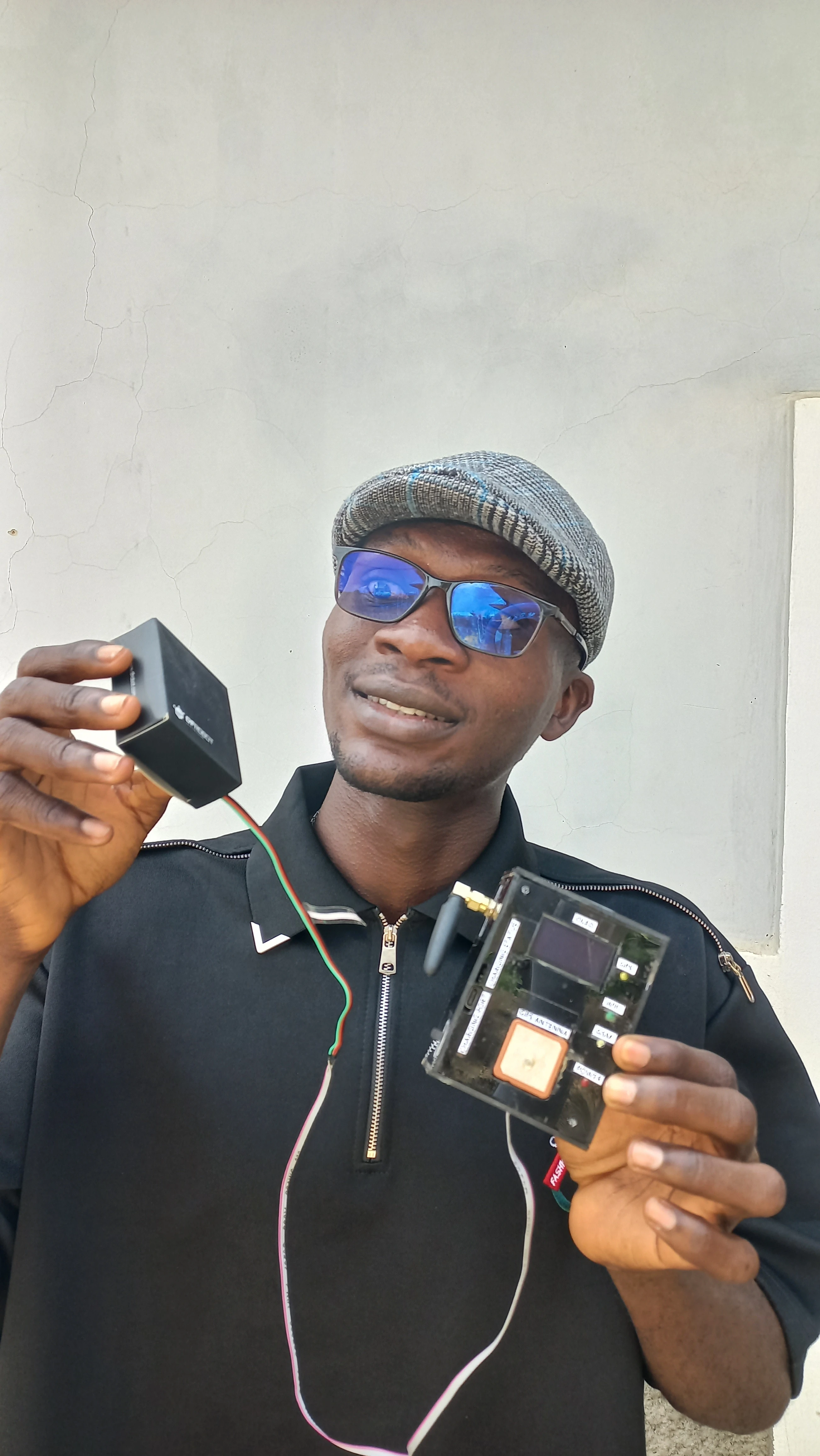Developer holding completed device with sunglasses