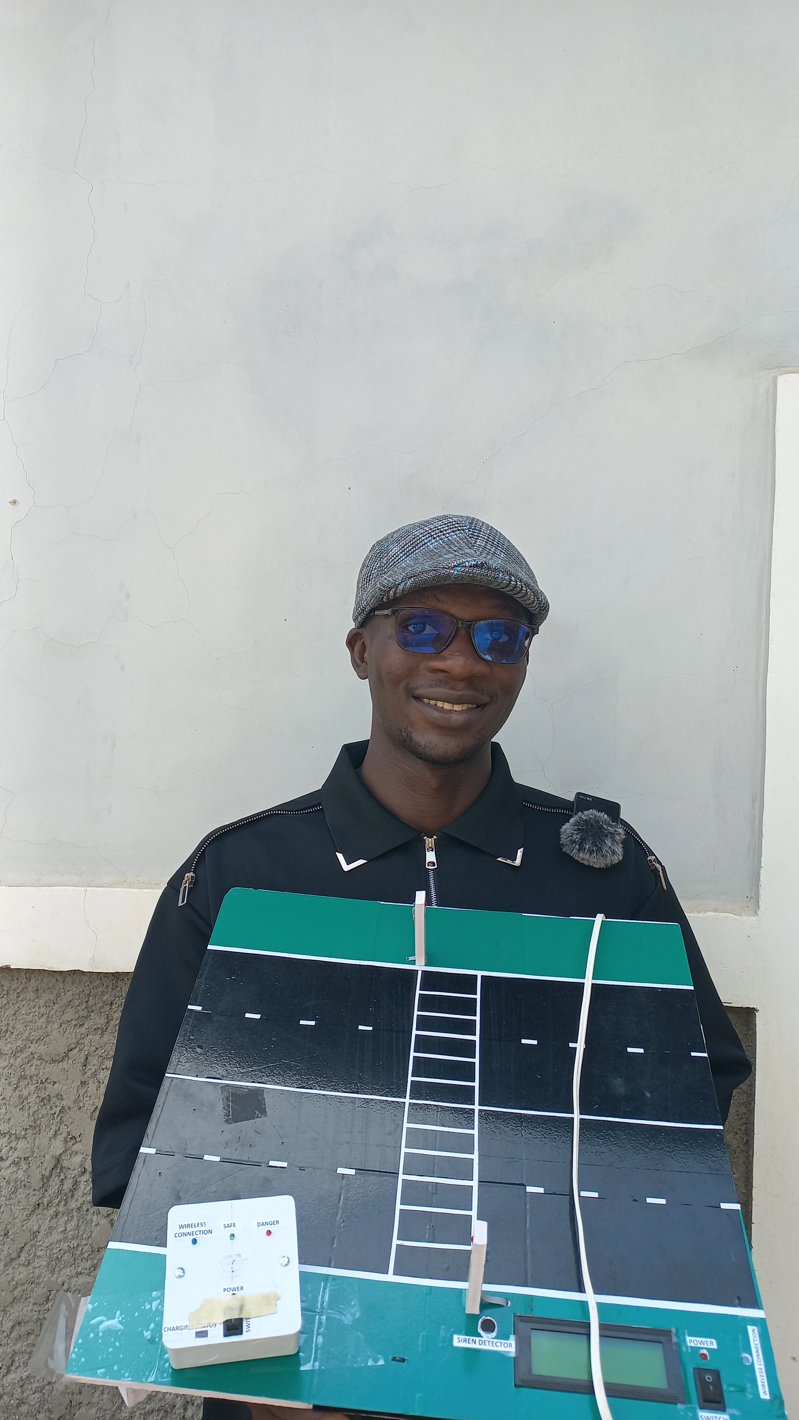 Developer wearing sunglasses, presenting the completed road model at the demonstration