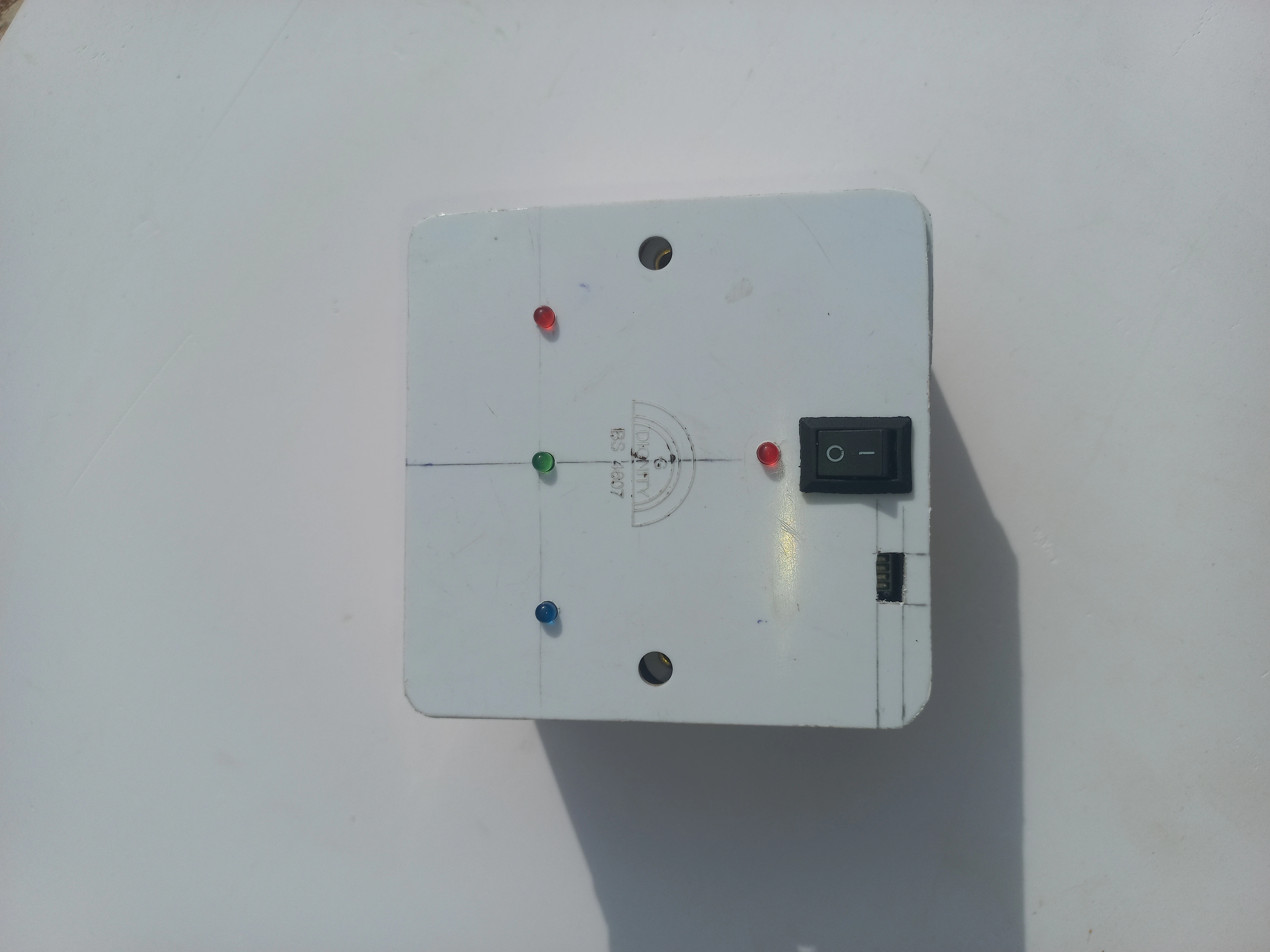 Wearable unit front panel with red, green, and blue LED indicators installed in their cutouts